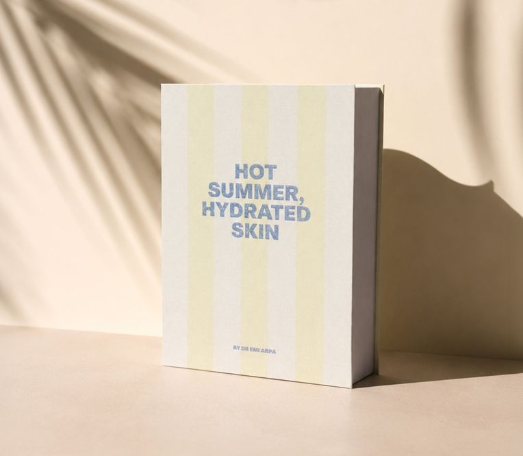 Ein Buch mit dem Titel „Heißer Sommer, gut durchfeuchtete Haut“ von Dr. Emi Arpa, mit einem sanften Schatten auf beigem Hintergrund.