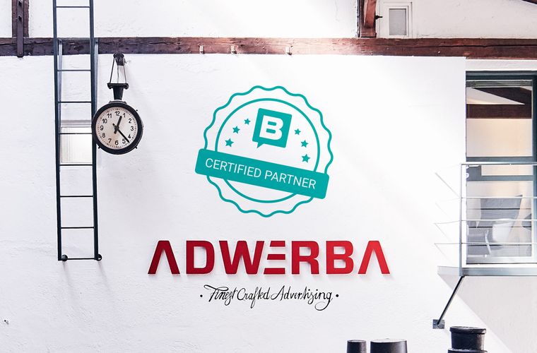 Wand eines Lofts mit Aufschrift ADWERBA und Finest Crafted Advertising und dem Certified Partner Logo von Storyblok